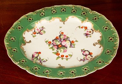 Lot 29 - An 18th century green dish with a pierced rim...