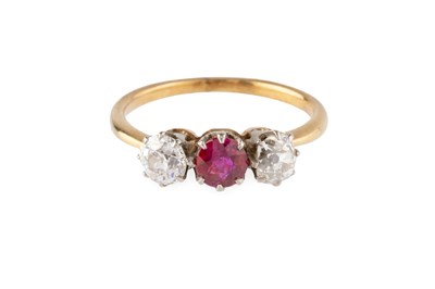 Lot 139 - A ruby and diamond three stone ring, the...