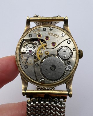 Lot 305 - A 9ct gold cased wristwatch, the circular dial...