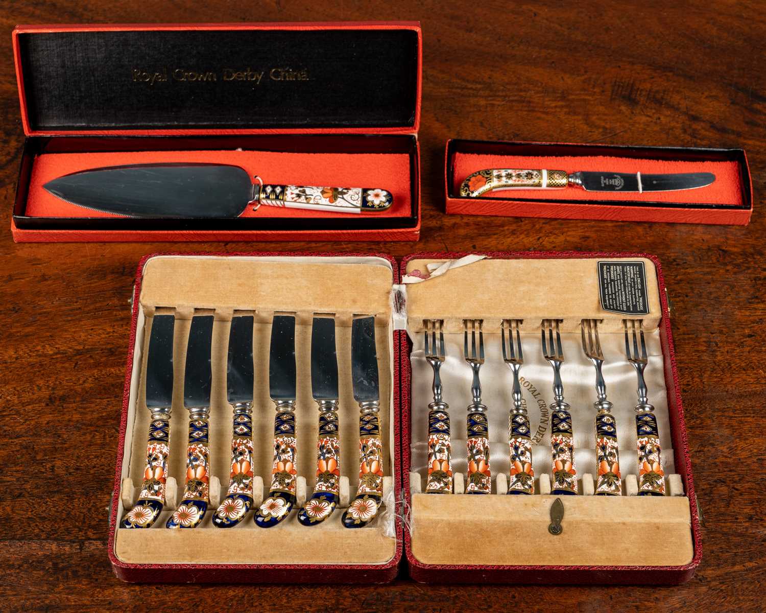 Lot 23 - Three boxes of Royal Crown Derby cutlery,...