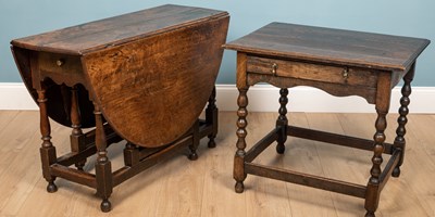 Lot 170 - An oak desk table with drawer and ball-turned...