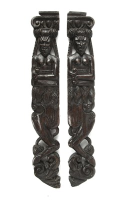 Lot 325 - A pair of antique early English carved oak...