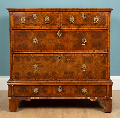 Lot 331 - An early 18th century oyster laburnum veneered chest of drawers