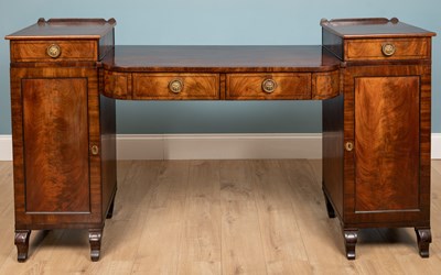 Lot 242 - A Regency mahogany sideboard, with brass lion...