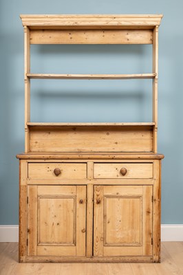 Lot 239 - A large pine kitchen dresser, 125 x 39 x 216 cm