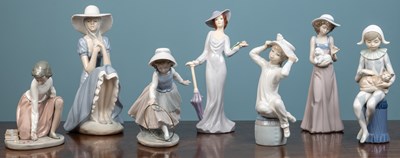 Lot 228 - A Lladro figurine, five Nao figurines and a...