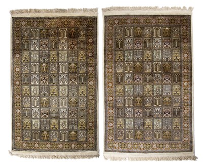 Lot 266 - A pair of Indian cream ground silk rugs with...