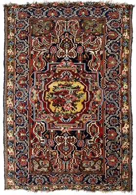 Lot 263 - An antique Persian polychrome woollen rug with...