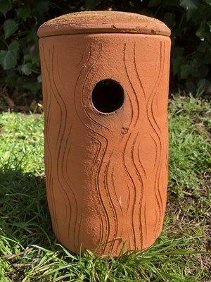 Lot 1142 - A mid to late 20th century terracotta hanging bird box