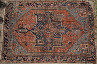 Lot 430 - A Heriz red and blue ground carpet; together with a Middle Eastern red ground carpet