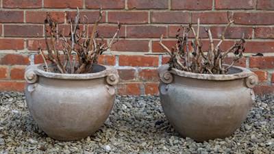 Lot 1110 - A pair of Compton Pottery buff terracotta urns