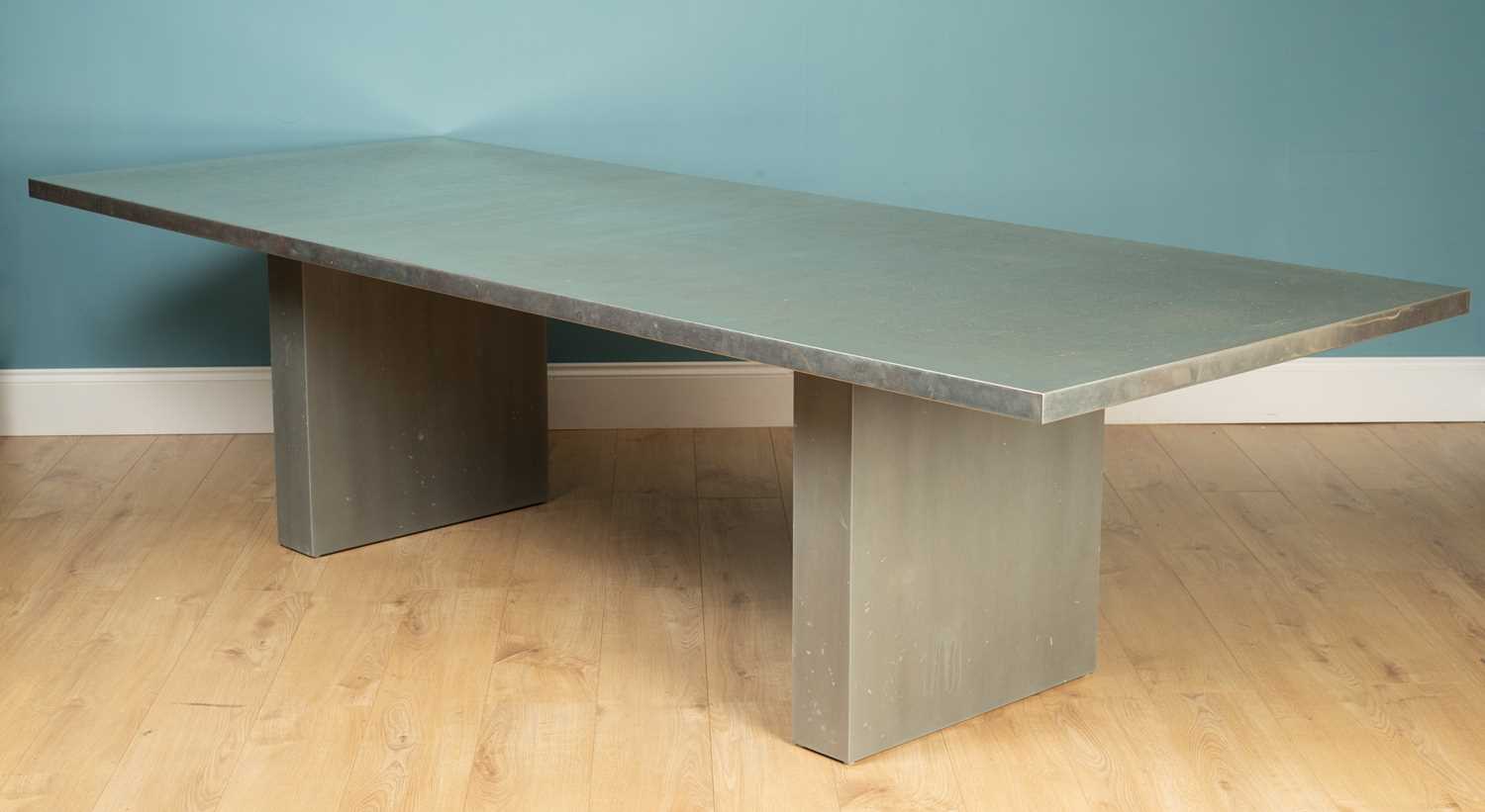 Lot 155 - A pewter-topped dining table from Benchmark