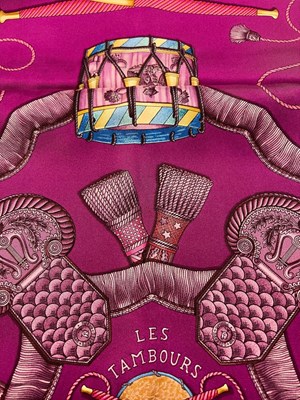 Lot 138 - A 'Les Tambours' silk scarf by Hermès,...