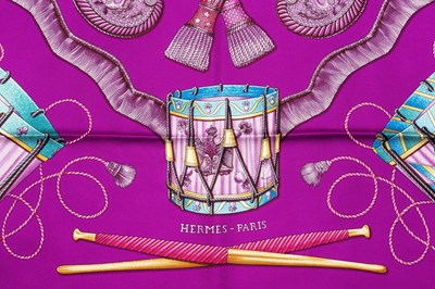 Lot 138 - A 'Les Tambours' silk scarf by Hermès,...