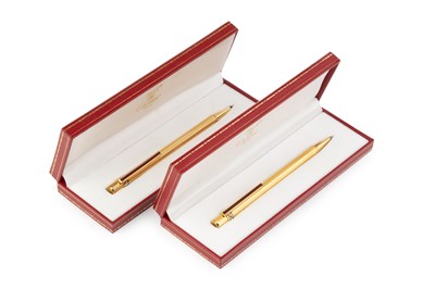 Lot 532 - A Must de Cartier gold plated ballpoint pen,...