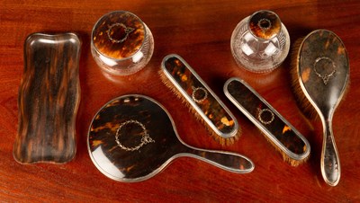 Lot 82 - A seven piece silver and tortoiseshell design...