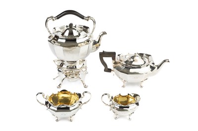 Lot 695 - A George V silver four piece tea service, of...