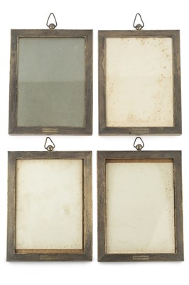 Lot 555 - A set of seven George V silver rectangular...