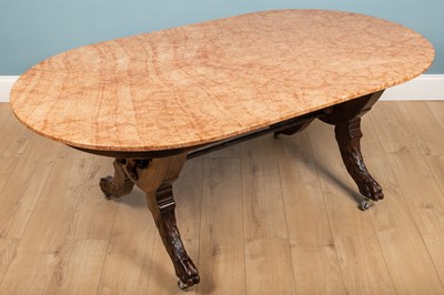 Lot 232 - A marble topped mahogany table with carved...