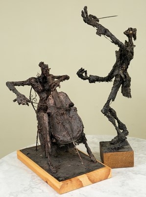 Lot 250 - Two musician sculptures, one female cellist on...