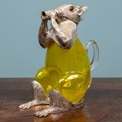 Lot 155 - A green glass and silver plated squirrel...