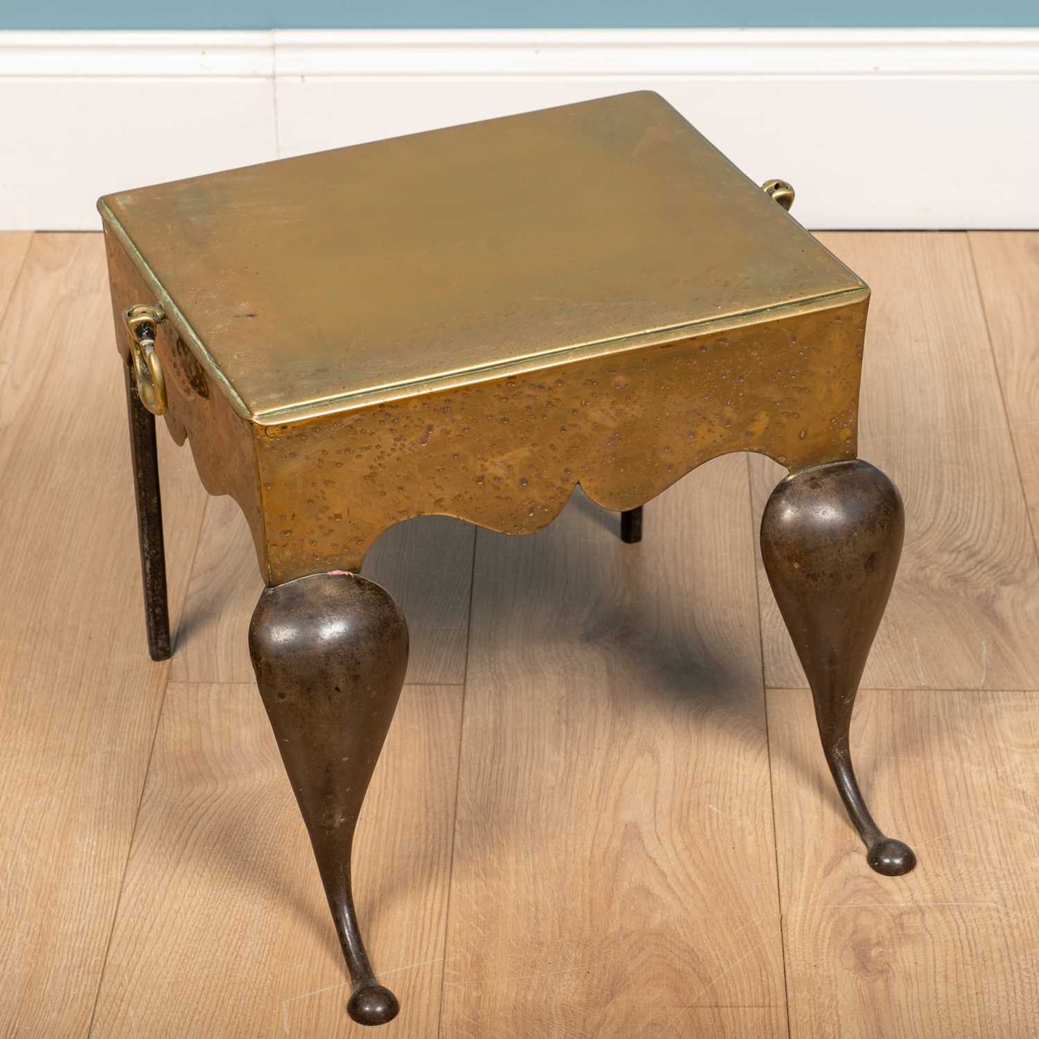 Lot 147 A 19th century brass trivet footman, with a