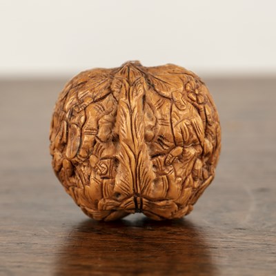 Lot 212 - Natural walnut Chinese, circa 1900 carved with...