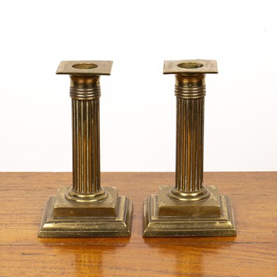 Lot 190 - Pair of brass corinthian column candlesticks...