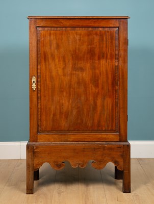 Lot 211 - A 19th century mahogany cupboard on stand