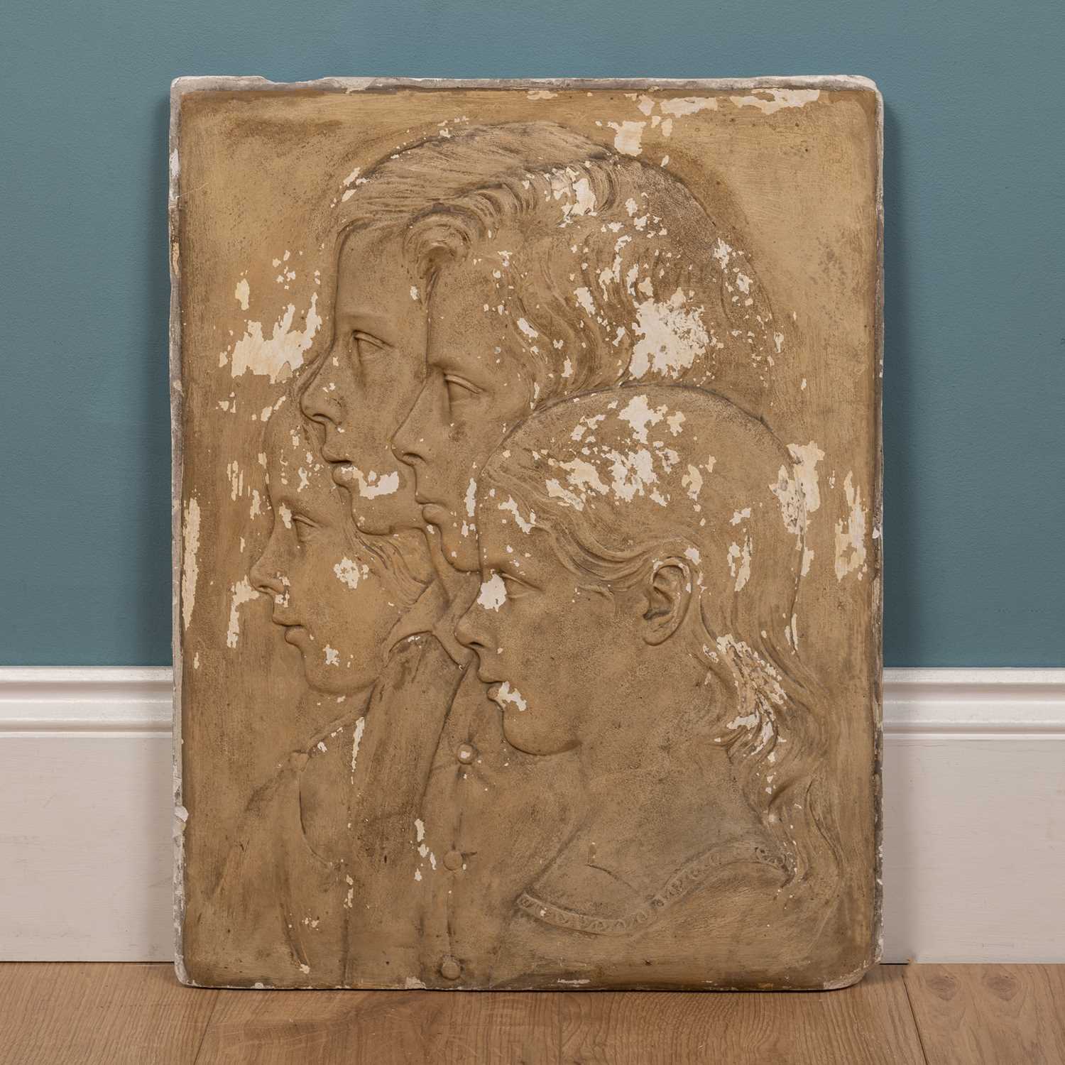 Lot 210 - A 19th Century plaster plaque with profile portraits in relief of four children