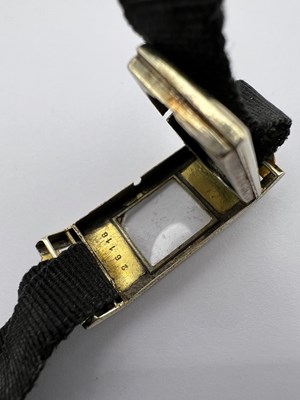 Lot 179 - An enamel cocktail watch, the rectangular...