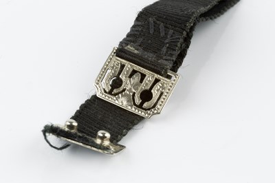 Lot 179 - An enamel cocktail watch, the rectangular...