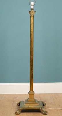 Lot 560 - An antique brass lamp standard