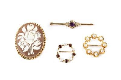 Lot 263 - Three gem set brooches, comprising an amethyst...