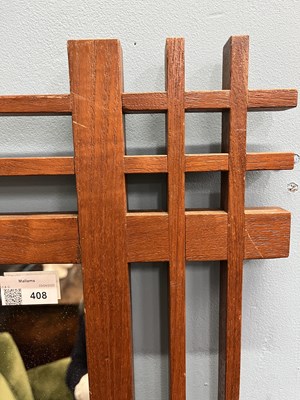 Lot 408 - A mid-century Italian, walnut wall mirror attributed to Ettore Sottsass
