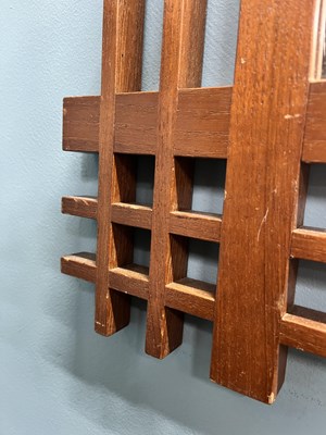 Lot 408 - A mid-century Italian, walnut wall mirror attributed to Ettore Sottsass