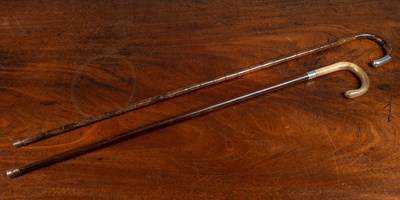 Lot 441 - Two antique walking sticks with silver mounts