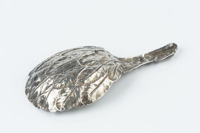 Lot 537 - A George III silver eagle's wing caddy spoon,...