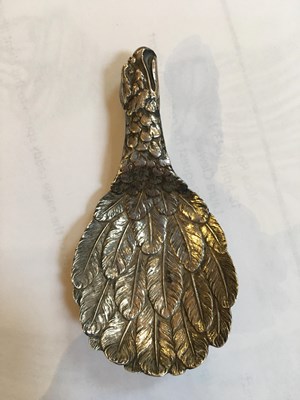 Lot 537 - A George III silver eagle's wing caddy spoon,...