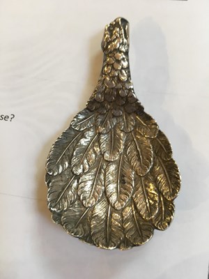 Lot 537 - A George III silver eagle's wing caddy spoon,...