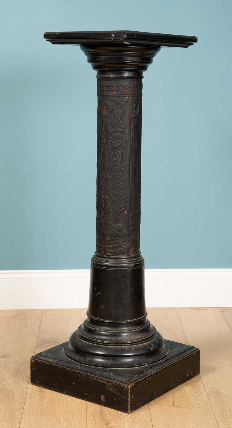 Lot 203 - A black pillar stand, carved wood with designs...