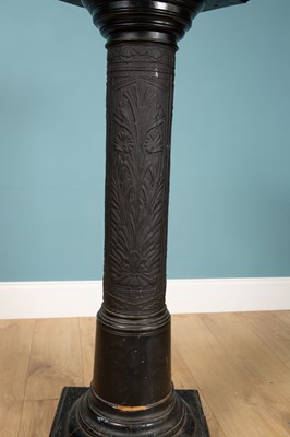 Lot 203 - A black pillar stand, carved wood with designs...