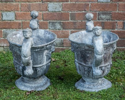 Lot 1094 - A pair of antique lead urns