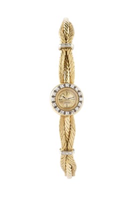 Lot 167 - A lady's diamond set bracelet watch by Omega,...