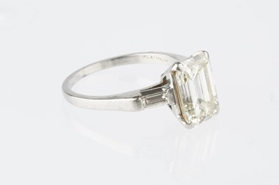 Lot 146 - A diamond single stone ring, the emerald-cut...