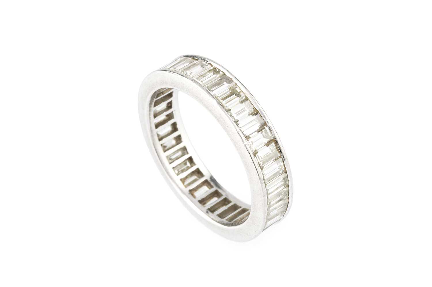 Lot 76 - A diamond full hoop eternity ring, channel set...