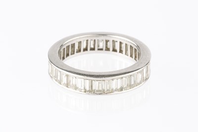 Lot 76 - A diamond full hoop eternity ring, channel set...