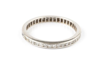 Lot 63 - A diamond full hoop eternity ring, channel set...