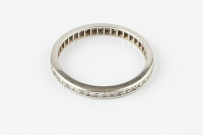 Lot 63 - A diamond full hoop eternity ring, channel set...