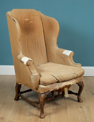 Lot 132 - An 18th or 19th century mahogany framed wingback armchair